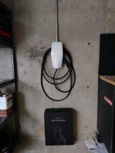 Electric vehicle charger mounted on wall